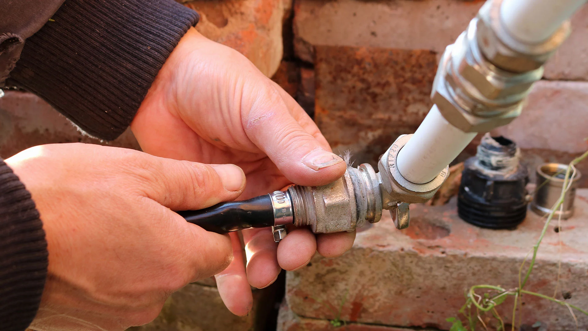 Fairview, TX irrigation repair expert is replacing a broken pipe and valve.