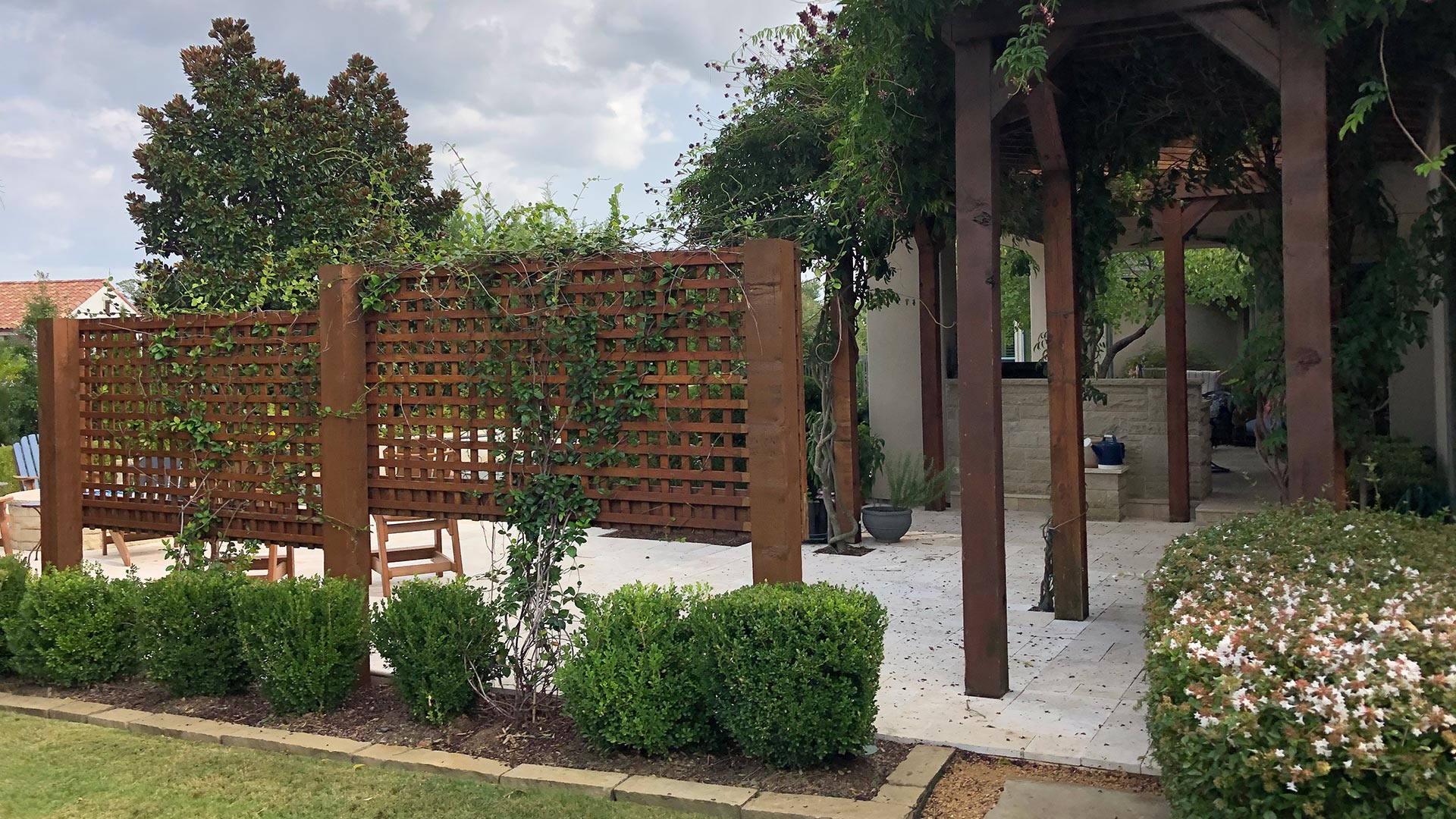 Landscaping installed alongside a walkway by a home in Murphy, TX. 