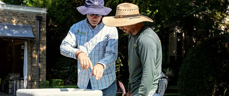 CitiTurf managers discussing spider mite treatments in Wylie, TX.