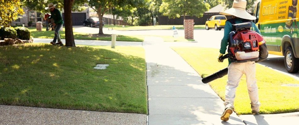 Debris being blown away from mowing services in McKinney, TX.