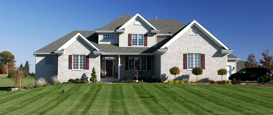 Home with mowed lawn in Parker, TX.