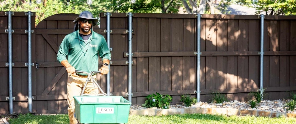 Professional fertilizing lawn in McKinney, TX.